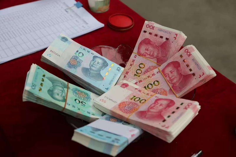 集體經(jīng)濟促發(fā)展，分紅增收暖民心。吳竹彧攝